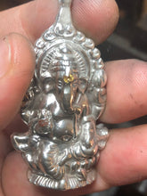 Load image into Gallery viewer, Sterling silver .925 Ganesh pendant with cast in place yellow and orange sapphire.
