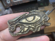 Load image into Gallery viewer, Eye of Horus pendant hand carved and cast in yellow bronze.
